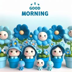 there are many small blue flowers in the potted planters and one is holding a baby doll