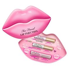 Too Faced Lip Injection Challenge in Limited Edition Pouty Lips Metal Tin Limited Edition Instant & Long term Lip Plumping Set New Limited Edition Tin, Collector's edition and Reusable Tin Box TRAVEL-SIZE TRIO: A trio that includes three travel-friendly versions of each Lip Injection formula for every level of lip plumping you may need.  INSTANT PLUMPING: The Lip Injection Plumping Lip Gloss has a volumizing technology that provides instant plumping results for the appearance of fuller lips.  HYDRATING: The Lip Injection Extreme Lip Plumper nourishes and conditions, while lips appear fuller from the first application and plumper overall over time.  VOLUMIZING FORMULA: The Lip Injection Extreme Maximum Plump Extra Strength Lip Plumper offers an advanced volumizing formula that dramatically Extreme Lip Plumper, Lip Plumpers, Sephora Holiday, Abdominal Binder, Lip Injection Extreme, Holiday Lip, Fuller Lips, Lip Plumping, Bare Lip