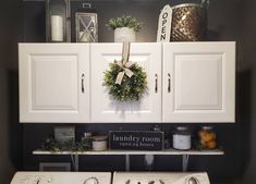 a white washer and dryer sitting next to each other in a laundry room