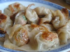 a plate with some dumplings on top of it