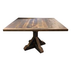 a wooden table with two cross legs and a square shaped top, against a white background