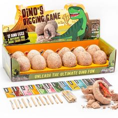 the dino's digging game is in its box and ready to be played with