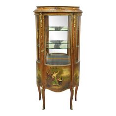 an antique china cabinet with glass doors and painted decoration on the front, side view