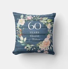 a blue floral pillow with the number 60 years printed on it