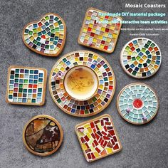 mosaic coasters are arranged on the floor with different designs and colors, including birds