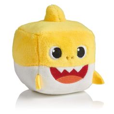 a yellow stuffed toy with a smile on it's face and mouth, sitting in front of a white background