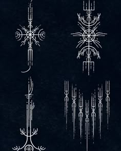 four different types of crosses on a black background, each with an intricate design in the middle