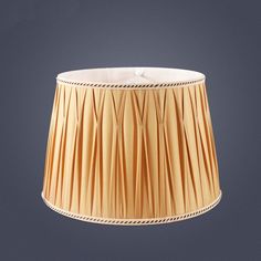 a lamp shade that is hanging from the ceiling