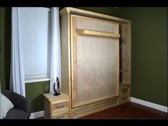 a large wooden cabinet sitting in the corner of a room