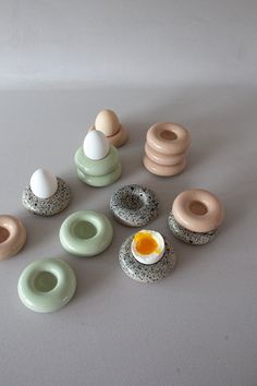 an assortment of donuts and eggs on a table