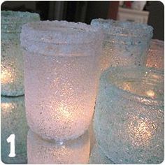 there are many frosted candles on the table