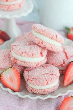 strawberry shortbread cookies with powdered sugar and fresh strawberries on the side, ready to be eaten