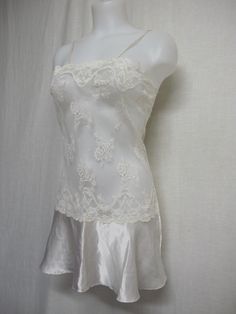 "Short White Lace and Satin Nightgown Unbelievably adorable! Sheer Baby doll /white nightie! Tons of lace with a satin flouncy skirt This is sassy! (Like You!) Small 36\" bodice 40\" Hip 32\" length Easy care poly GREAT for brides! https://www.etsy.com/shop/BelindasStyleShop" Lace Camisole Nightgown For Bedtime, Fitted Ruffle Nightgown For Bedtime, Fitted Ruffled Nightgown For Sleep, Fitted Delicate Lace Nightgown For Party, Fitted Coquette Nightgown For Wedding Night, White Lace Sleepwear For Bedtime, White Nightgown Short, Lace Nightgown Camisole For Night, Feminine Fitted Nightgown With Ruffles