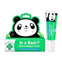 a tube of toothpaste sitting next to a panda bear stick on a white background