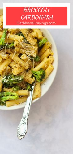 broccoli carbonara pasta in a white bowl with a spoon on the side