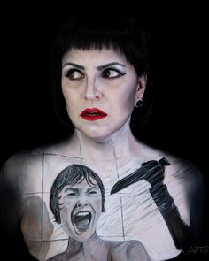 a woman with makeup painted to look like she is holding a knife