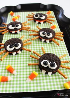 halloween treats made to look like spideres on a table with green and white checkered cloth