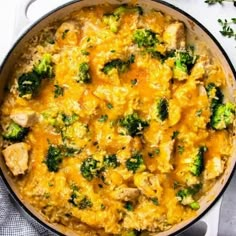 chicken and broccoli casserole in a skillet on a white surface