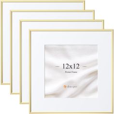 four white frames with gold trim