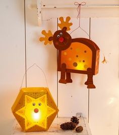 a light that is sitting on top of a table next to a lamp and some pine cones