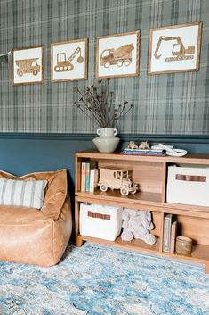 a living room filled with furniture and pictures on the wall next to a book shelf