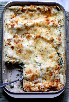 a casserole dish with broccoli and cheese in it, ready to be eaten