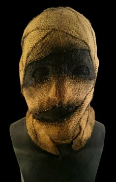 a mannequin's head is covered in burlap