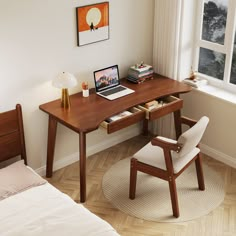 a laptop computer sitting on top of a wooden desk next to a bed in a bedroom