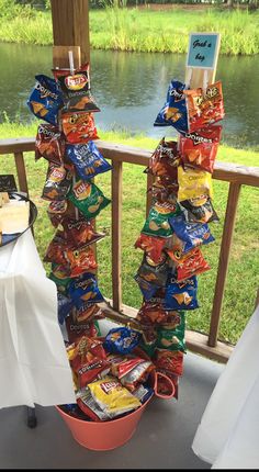 a stack of chips sitting on top of a table next to a river