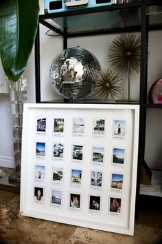 a mirror ball sitting on top of a table next to a shelf filled with pictures