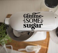 a sticker that says gimme some sugar on the side of a blender