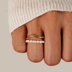 Keep it elegant & sleek with this Orelia Pearl Double Layer Ring. Wear alone or stack with other minimalist rings for that effortless look.  18K gold plated, copper Freshwater pearl Hypoallergenic, lead & nickel free  US/Canada Ring Size UK/AU Ring Size Inside Diameter (mm) 6 L 16.6mm 7 N 17.2mm 8 P 18.1mm  If Silversmithing Jewelry, Layered Rings, Shine Bright Like A Diamond, Beauty Clothes, Minimalist Rings, Dainty Ring, Pearl Ring, High Quality Jewelry, Minimalist Jewelry