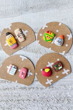 three small magnets are placed on top of a piece of brown paper with food