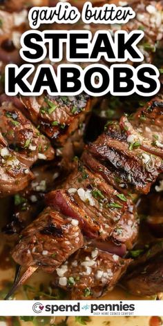 steak kabobs on skewers with text overlay that reads garlic butter steak kabobs