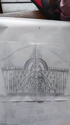 an image of a drawing on the side of a piece of paper that is sitting on top of a table