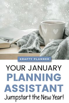 a cup of coffee sitting on top of a desk next to a book and blanket