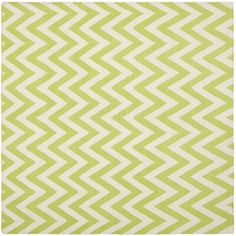 a green and white rug with zigzag pattern