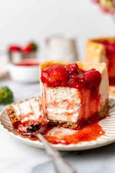 a piece of cheesecake on a plate with strawberry sauce