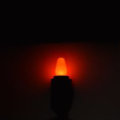 a red light shines in the dark