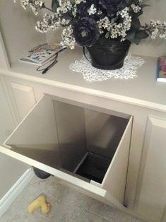 an image of a white cabinet with flowers in it and the caption reads laundry chute design, pictures, remodel, decor and ideas - page 2