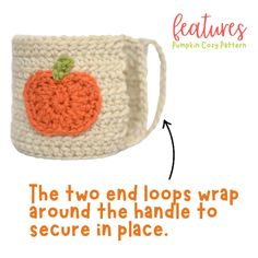 a crocheted mug cozy with an orange pumpkin on the side and text that reads, the two end loops wrap around the handle to secure in place