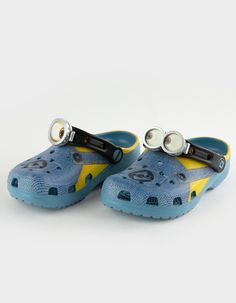 Crocs X Minions Clogs. Bello! The Minions Classic Clog Is Designed To Look Like Your Favorite Yellow Character, Complete With Printed Denim Overalls. The Ankle Strap Features An Eyeball With Goggles, To Top Off The Essential Minions Look. Minions Logos Adorn The Rivet And Heel, While The Entire Design Is Supported By The Iconic Comfort Of Crocs. Incredibly Light And Fun To Wear. Custom-Printed Minions Outfit Graphic. Molded Tpu Eyeball With Goggle On Ankle Strap. Water-Friendly And Buoyant, Weig Casual Blue Plastic Sandals, Blue Closed Toe Plastic Sandals, Playful Plastic Clogs For The Beach, Playful Plastic Clogs For Beach, Playful Plastic Beach Clogs, Blue Non-slip Fun Clogs, Fun Blue Non-slip Clogs, Blue Fun Slip-on Clogs, Cute Non-slip Plastic Clogs