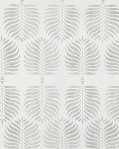 a white and grey wallpaper with leaves on it's back side, as well as an abstract design