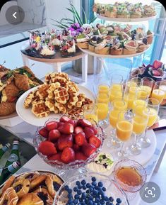 an assortment of desserts and pastries on a buffet table