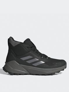 adidas Terrex Trailmaker 2 GORE-TEX Men's Hiking BootsSize & FitStandard fitAvailable in sizes 7-12Weight: 346 g (size UK 5.5)Midsole drop: 9 mm (heel: 27 mm/forefoot: 18 mm)DetailsEnd use: HikingMen's Trailmaker 2 GORE-TEX Hiking Boots by adidas TerrexDark GreyVersatile yet lightweight, the adidas Terrex Trailmaker 2.0 GORE-TEX includes a waterproof GORE-TEX membrane that's guaranteed to keep you dry when you're on the trials. An EVA midsole offers comfort, fit and feel, and a grippy Continental™ sole to equip you for everything from easy trails to rugged terrain. Whether you're just starting out or an adventurer, you'll find reliable performance and all-day comfort whatever your summit.Lace closureSynthetic upper with seamless overlaysWaterproof GORE-TEX membrane with a gusseted tongue c Gore Tex Hiking Boots, Adidas Terrex, Gore Tex, Hiking Boots, 12 Months, Dark Grey, Comfort Fit, Hiking, Adidas