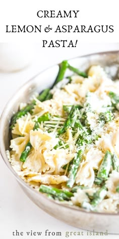 creamy lemon and asparagus pasta with parmesan cheese in a silver bowl