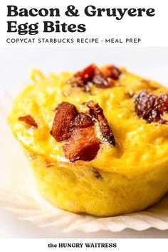 the bacon and gruyre egg bites cookbook is open on top of a white plate