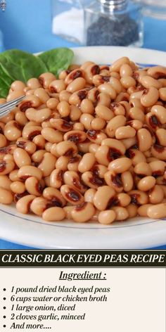 a white plate topped with lots of beans