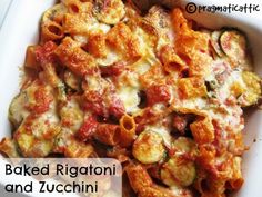 baked rigatoni and zucchini in a casserole dish on a white plate