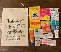 the contents of a mexican lunch bag laid out on a wooden table, including toothpaste, wipes and mouthwash